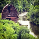 Red barn on river